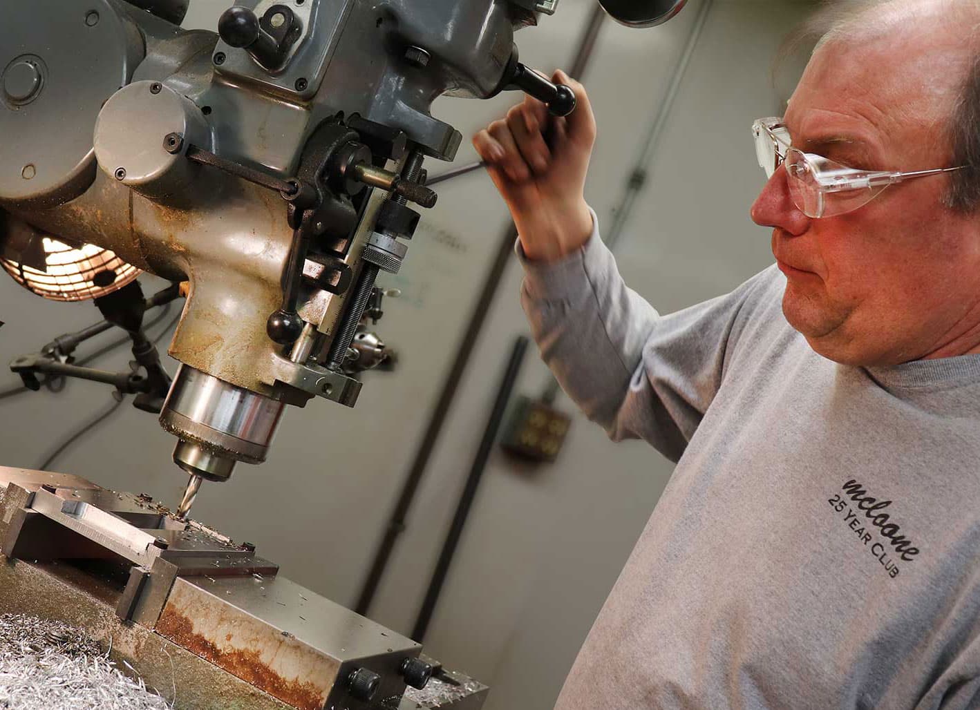 McLoone machinist at a drill press
